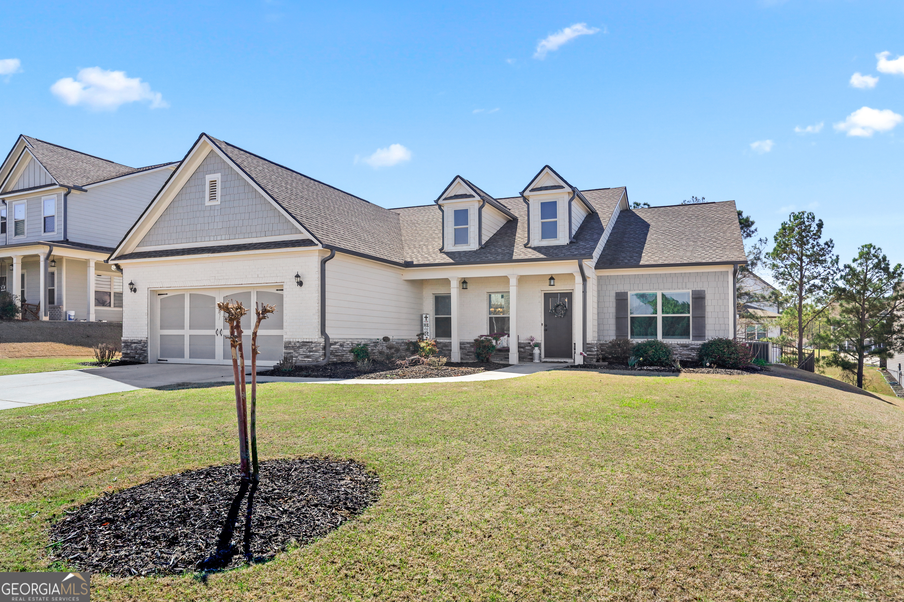 549 Calgary Downs Drive Winder, GA 30680 - Photo 1 of 1 a front view of a house with a yard