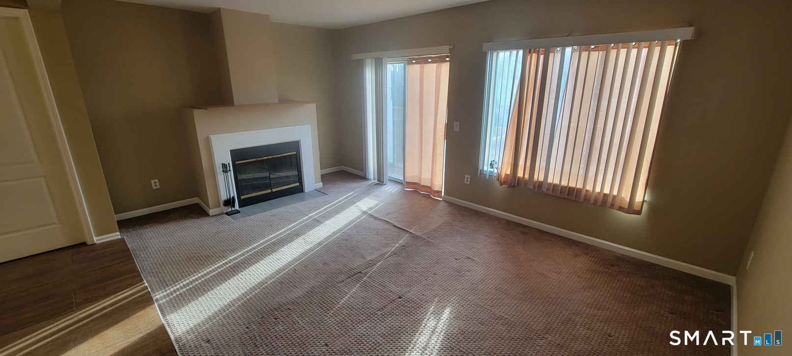 166 Old Brookfield Road, Unit 314 Danbury, CT 06811 - Photo 12 of 37 a view of livingroom with fireplace