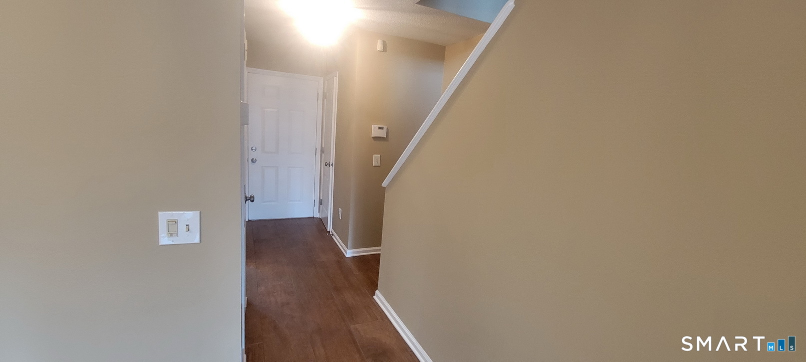 166 Old Brookfield Road, Unit 314 Danbury, CT 06811 - Photo 17 of 37 a view of a hallway with wooden floor