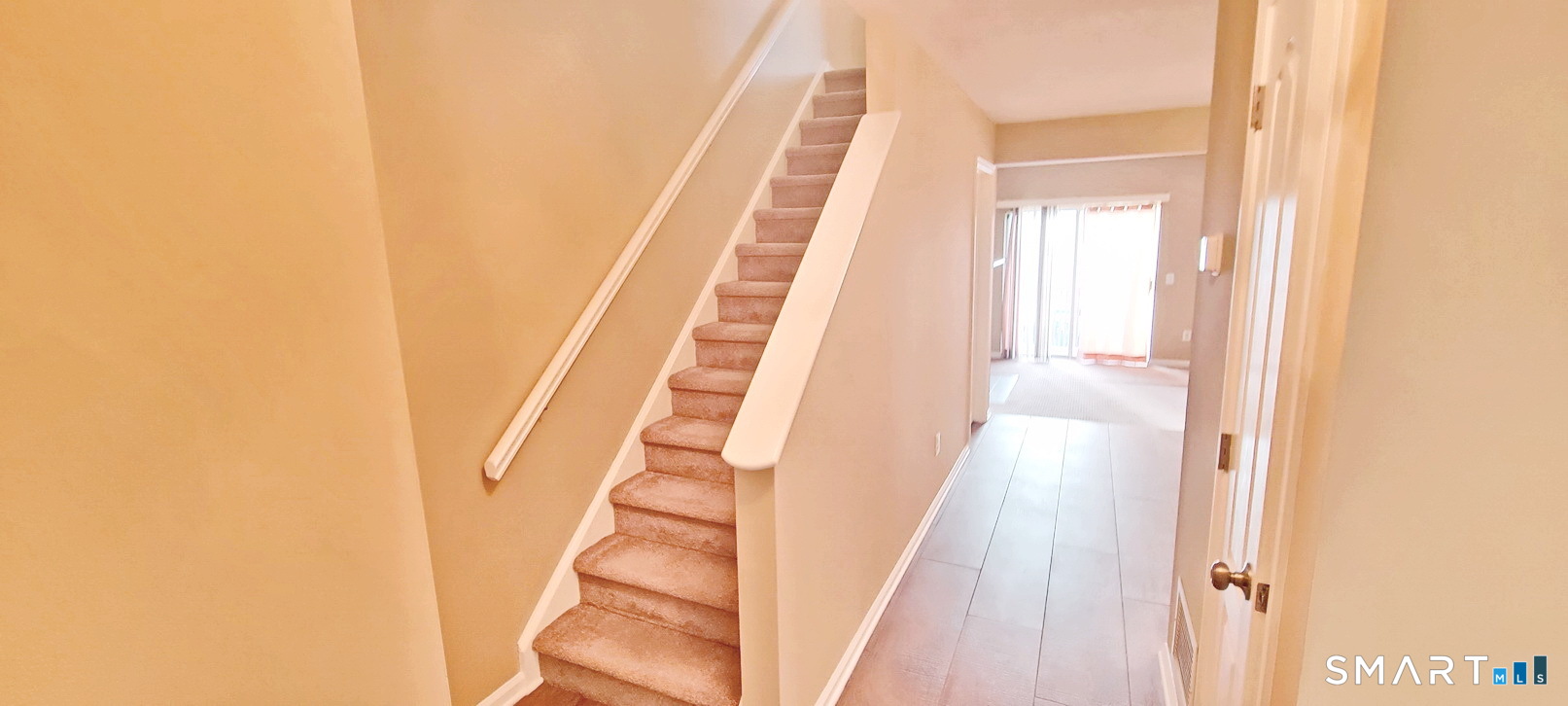 166 Old Brookfield Road, Unit 314 Danbury, CT 06811 - Photo 19 of 37 a view of staircase with white walls and a window