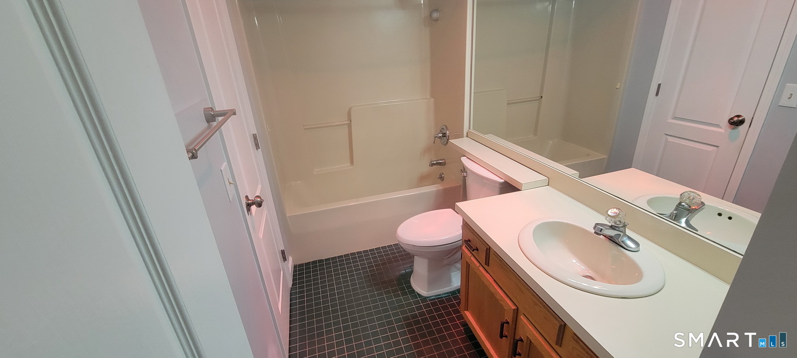 166 Old Brookfield Road, Unit 314 Danbury, CT 06811 - Photo 28 of 37 a bathroom with a sink a toilet and shower