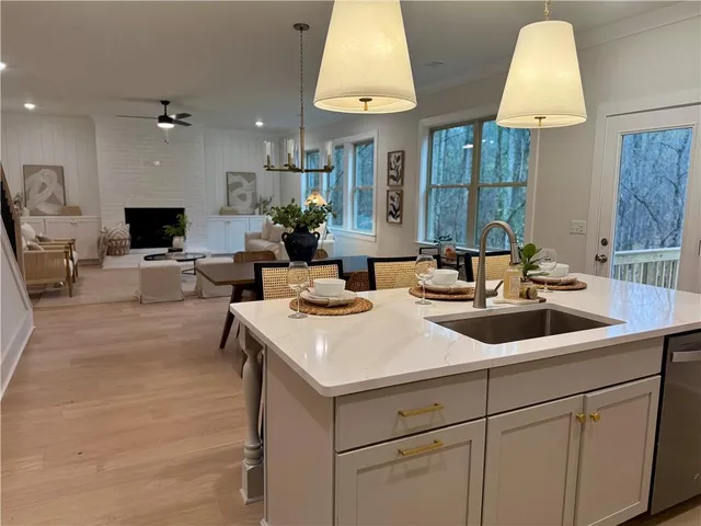 a view of living room with granite countertop furniture and a fireplace