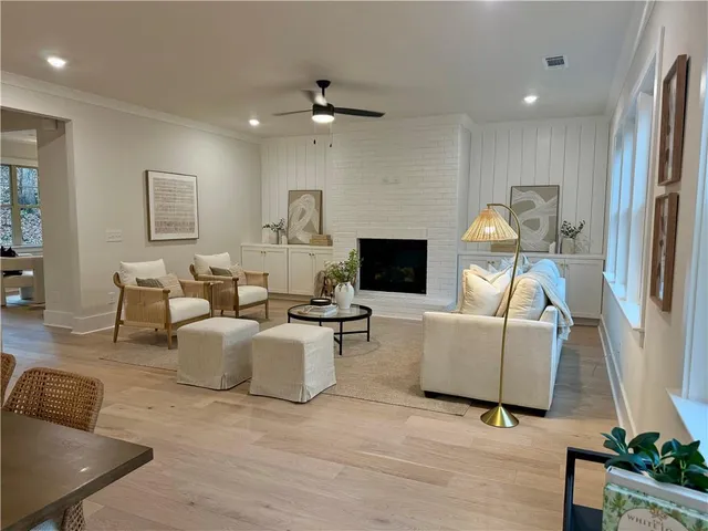 a living room with furniture and a fireplace