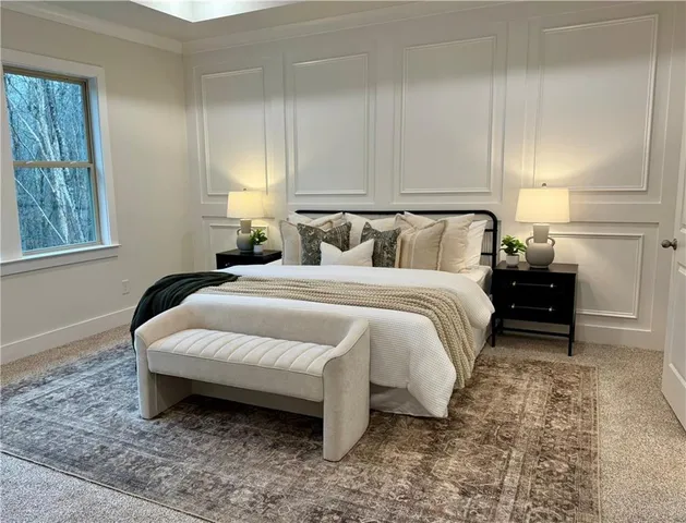 a spacious bedroom with a bed and window