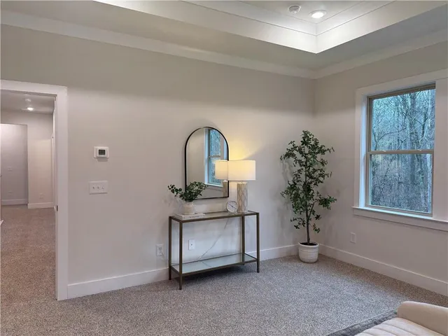 a view of entryway with flower garden