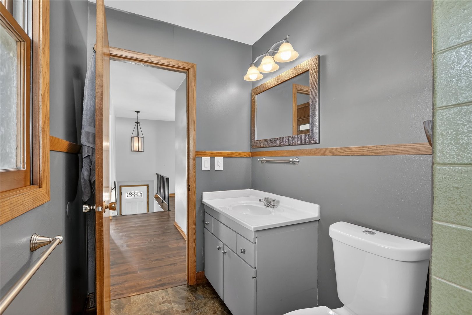 5103 Brookview Road Rockford, IL 61107 - Photo 17 of 51 a bathroom with a toilet sink and mirror