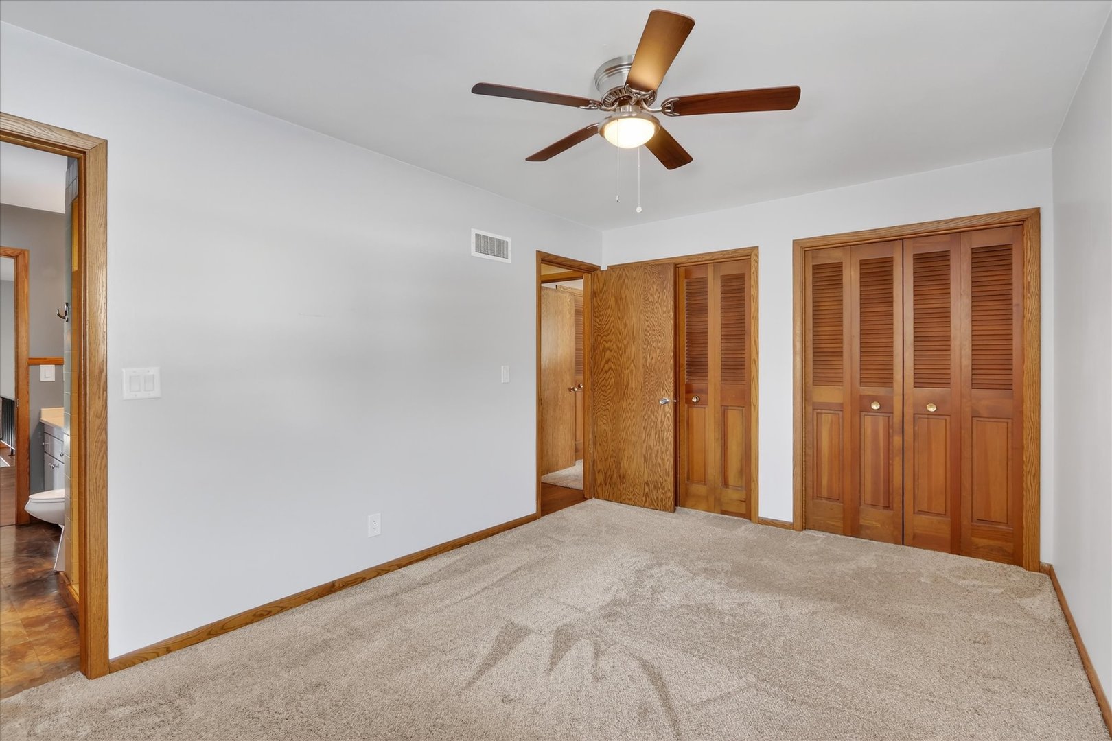 5103 Brookview Road Rockford, IL 61107 - Photo 26 of 51 a view of a livingroom with a ceiling fan and a window