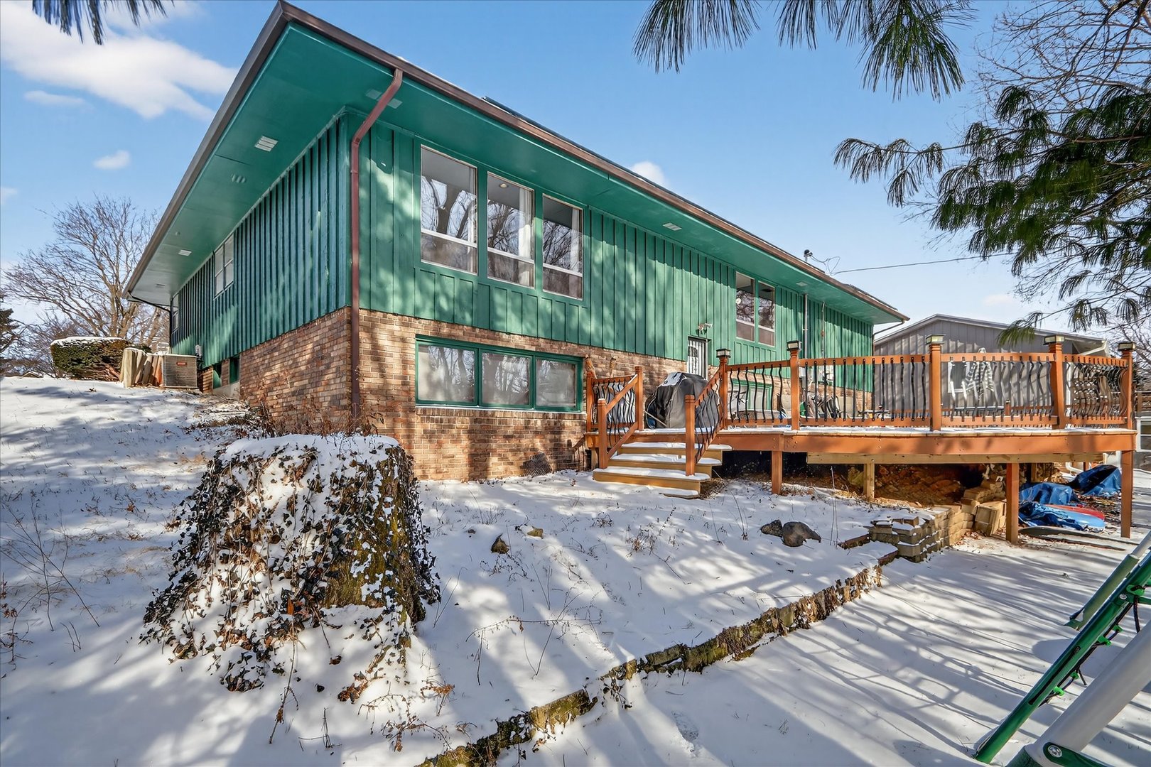 5103 Brookview Road Rockford, IL 61107 - Photo 42 of 51 a backyard of a house with barbeque oven table and chairs