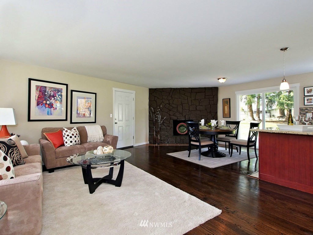 18430 Southeast 135th Street Renton, WA 98059 - Photo 4 of 13 a living room with furniture and wooden floor