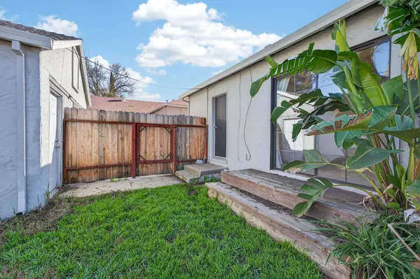a backyard of a house with lots of green space
