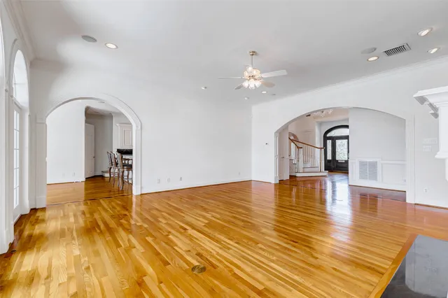a kitchen with stainless steel appliances kitchen island granite countertop a stove a sink and a refrigerator
