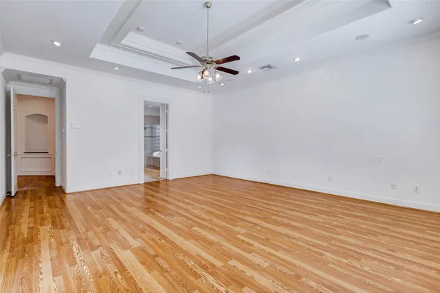 a bathroom with white cabinets granite counter tops and a sink