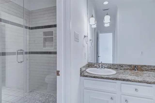 a view of a brick house with large windows