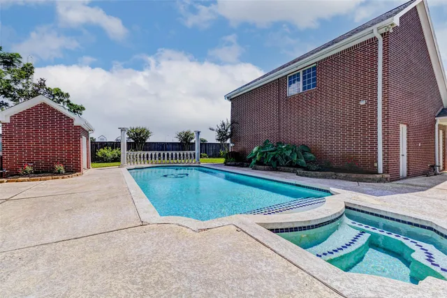 a view of a pool with a yard
