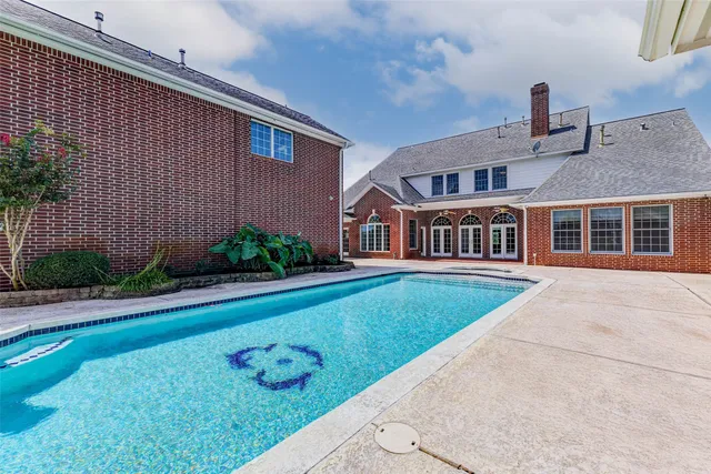 a kitchen with white cabinets and a stove