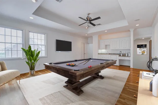 a spacious bedroom with a bed a couch and a window