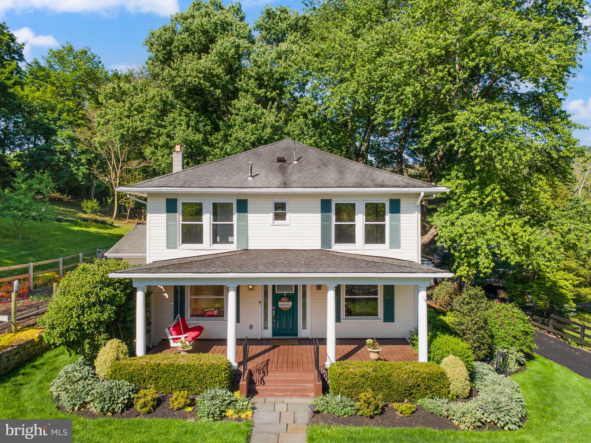 37151 Branchriver Road Purcellville, VA 20132 - Photo 8 of 63 a front view of a house with a yard and potted plants