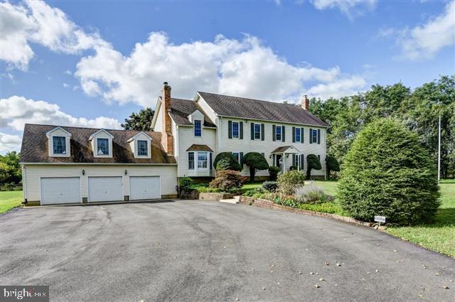 596 Province Line Road Allentown, NJ 08501 - Photo 1 of 50 a front view of a house with a yard and garage
