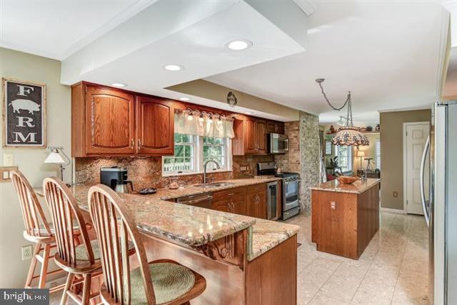 596 Province Line Road Allentown, NJ 08501 - Photo 11 of 50 a kitchen with a sink stove and refrigerator