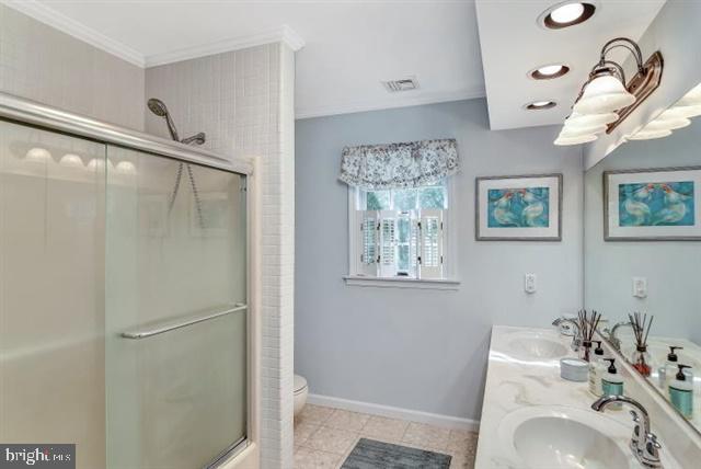 596 Province Line Road Allentown, NJ 08501 - Photo 21 of 50 a bathroom with a sink a window and a shower