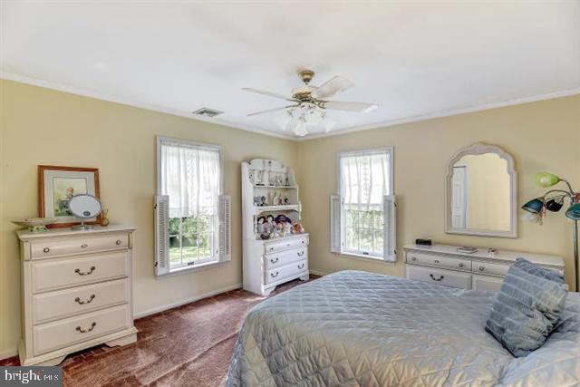 596 Province Line Road Allentown, NJ 08501 - Photo 22 of 50 a bed room with a bed and a dresser