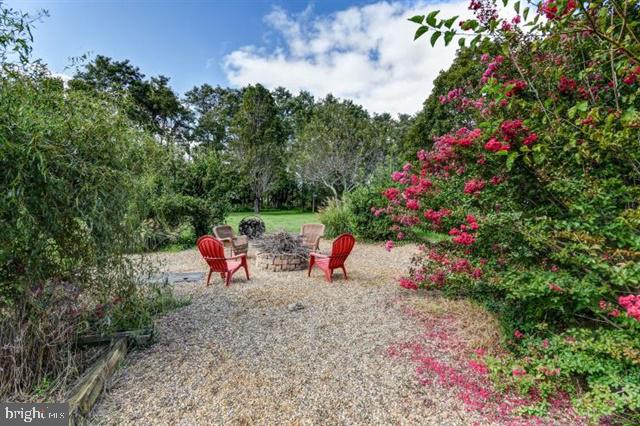 596 Province Line Road Allentown, NJ 08501 - Photo 30 of 50 a view of a backyard with sitting area and flowers