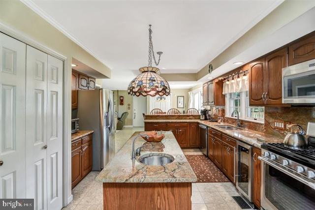 596 Province Line Road Allentown, NJ 08501 - Photo 9 of 50 a kitchen with stainless steel appliances granite countertop a sink stove and refrigerator