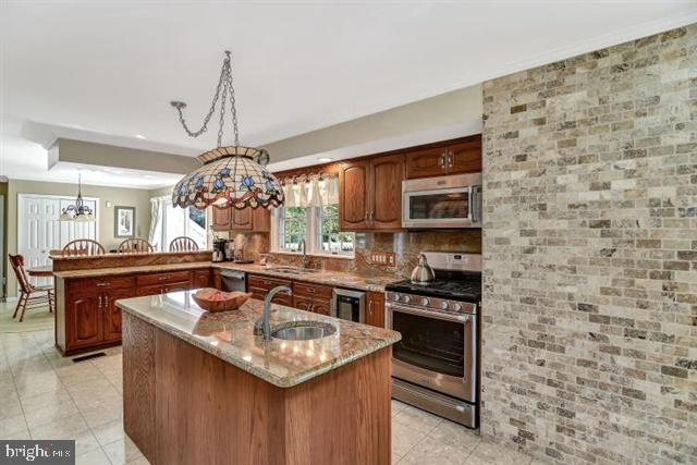 596 Province Line Road Allentown, NJ 08501 - Photo 10 of 50 a kitchen with a sink stove and microwave