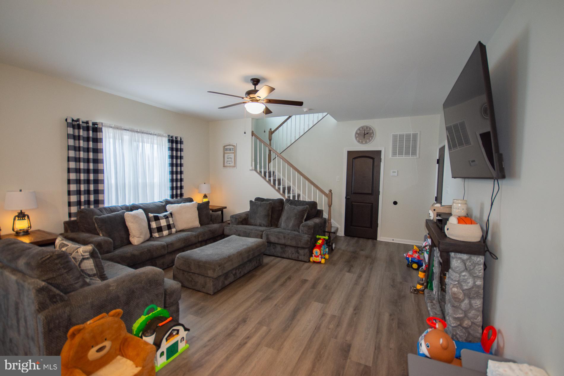 90 Larimar Lane Inwood, WV 25428 - Photo 11 of 66 a living room with furniture and a flat screen tv