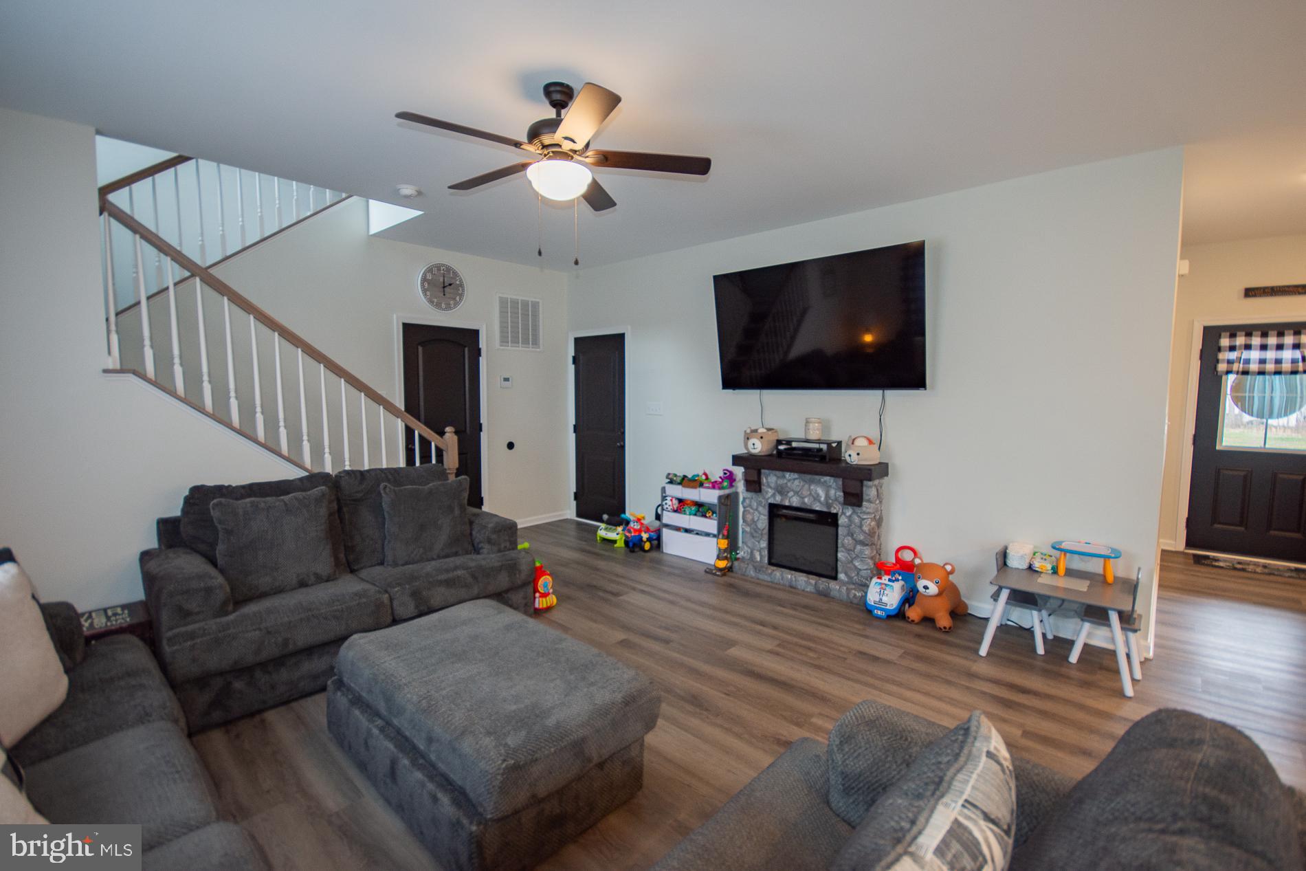 90 Larimar Lane Inwood, WV 25428 - Photo 12 of 66 a living room with furniture and a flat screen tv