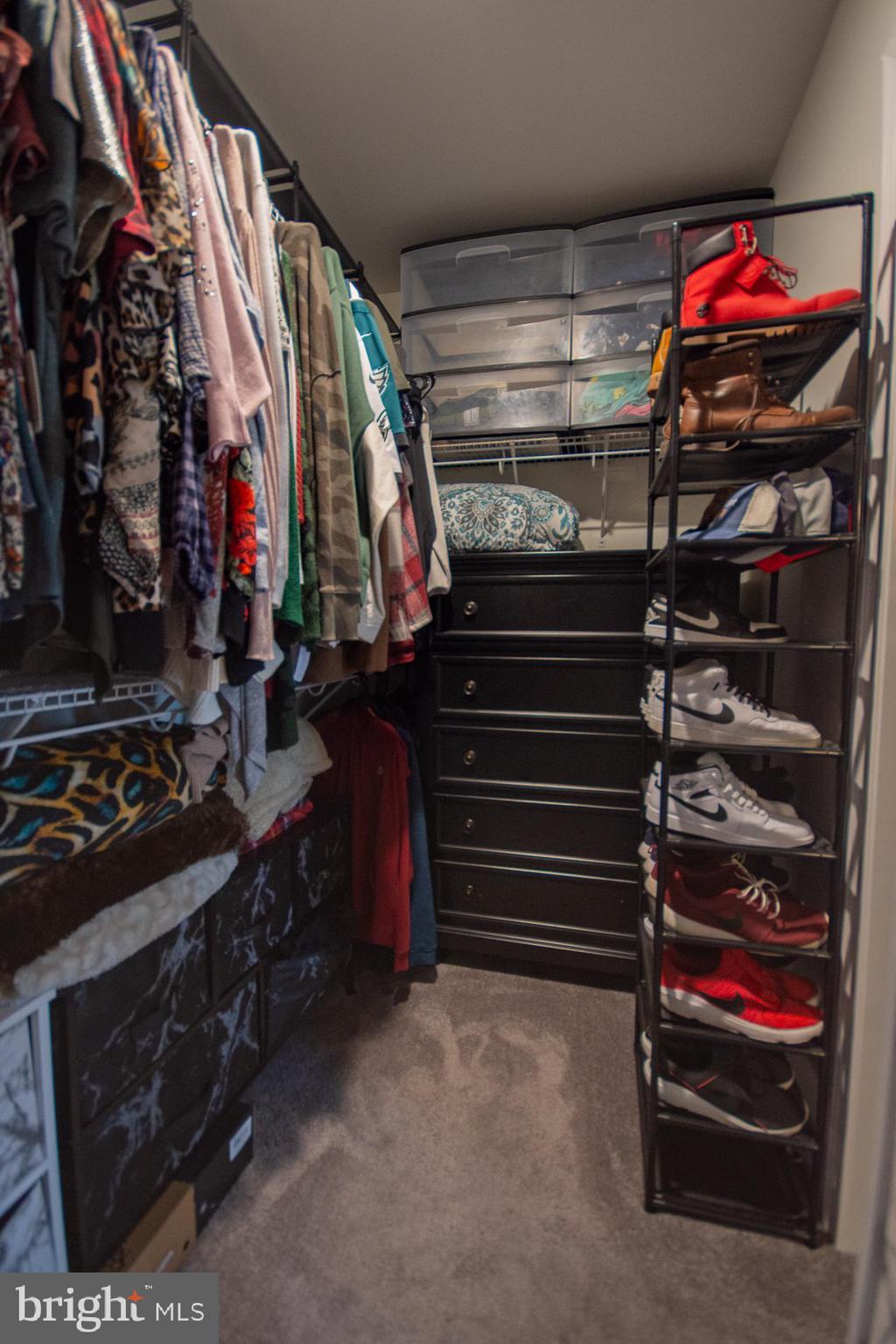 90 Larimar Lane Inwood, WV 25428 - Photo 18 of 66 a view of walk in closet with clothes and shoes