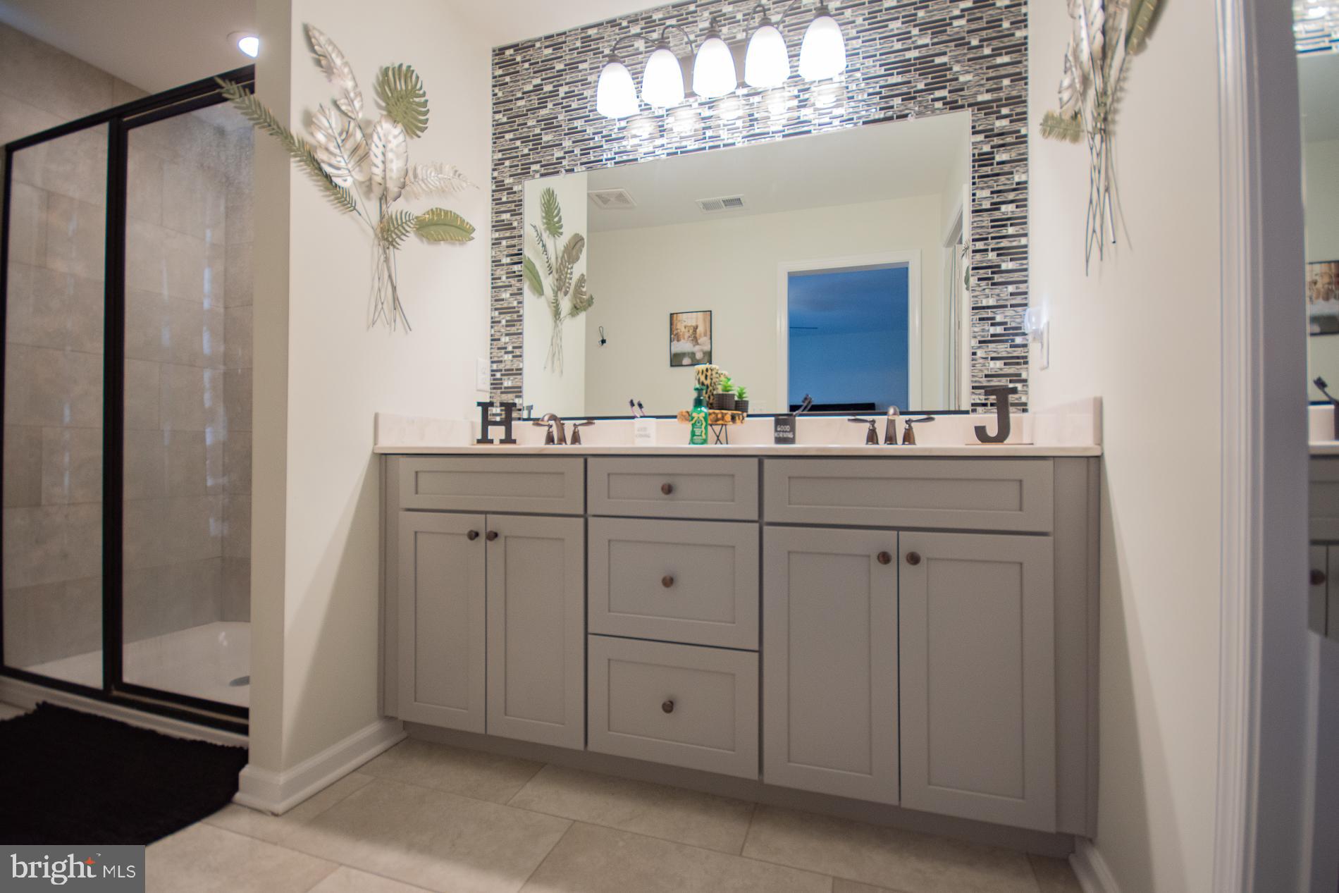 90 Larimar Lane Inwood, WV 25428 - Photo 20 of 66 a bathroom with a double vanity sink and mirror