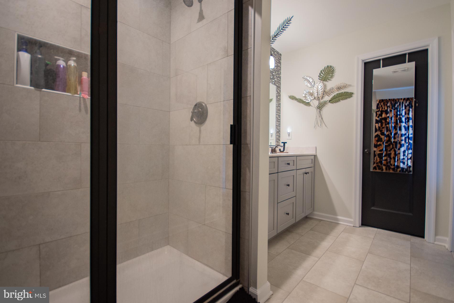 90 Larimar Lane Inwood, WV 25428 - Photo 22 of 66 a bathroom with a glass door shower and a sink