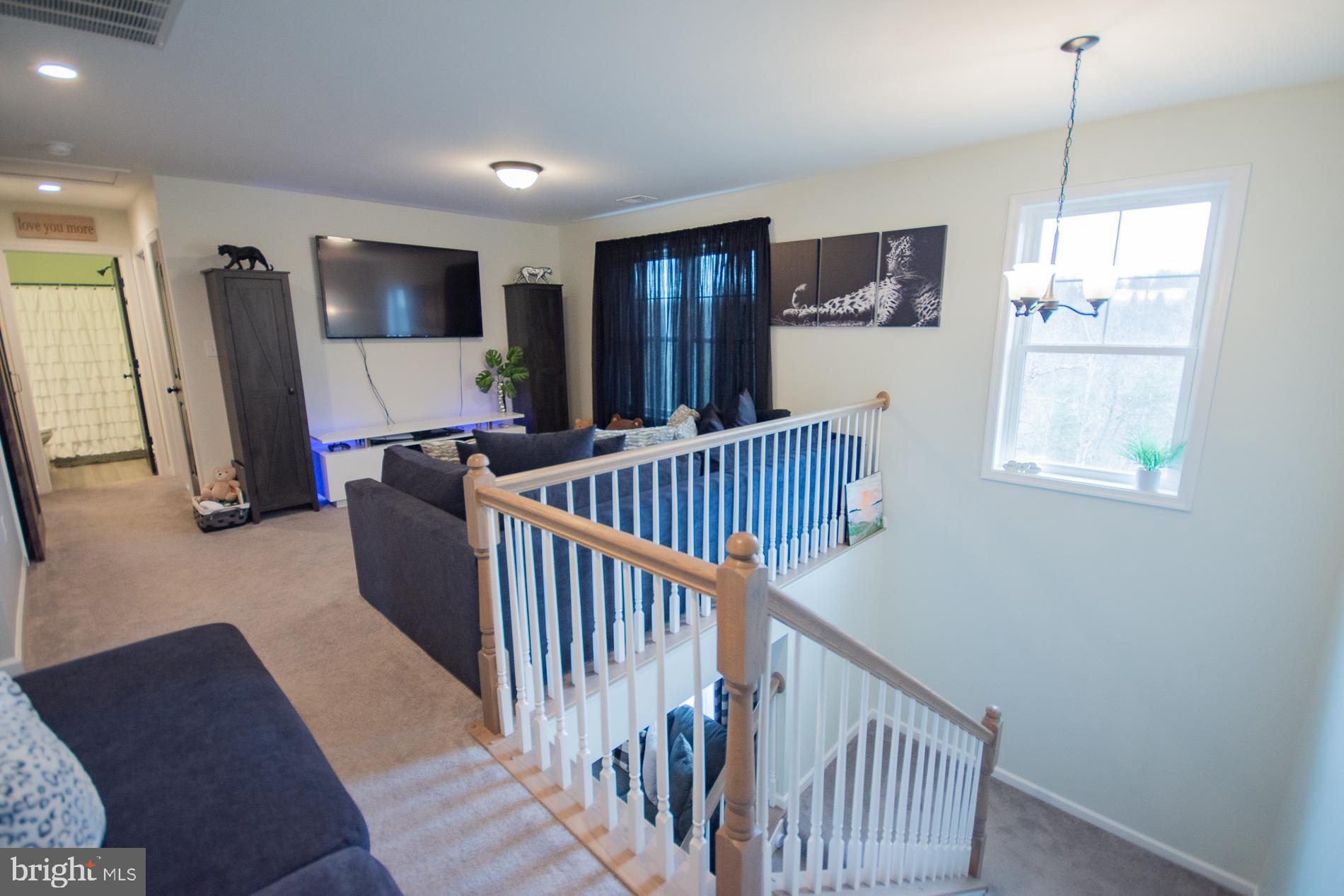 90 Larimar Lane Inwood, WV 25428 - Photo 24 of 66 a view of a hallway with windows and stairs