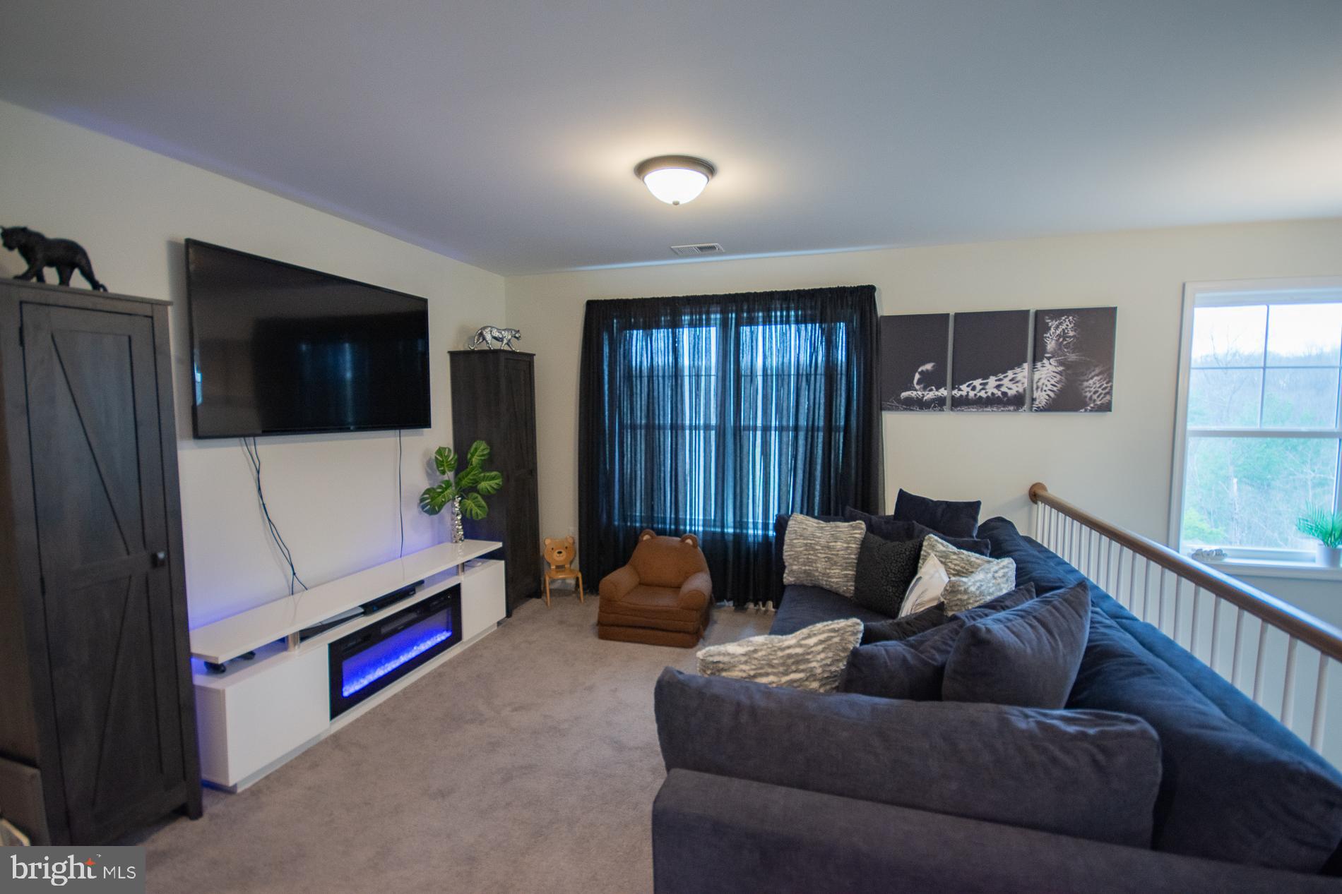 90 Larimar Lane Inwood, WV 25428 - Photo 25 of 66 a living room with furniture and a flat screen tv
