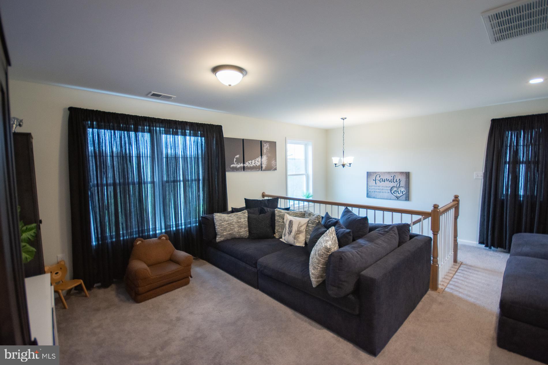 90 Larimar Lane Inwood, WV 25428 - Photo 26 of 66 a living room with furniture and a window