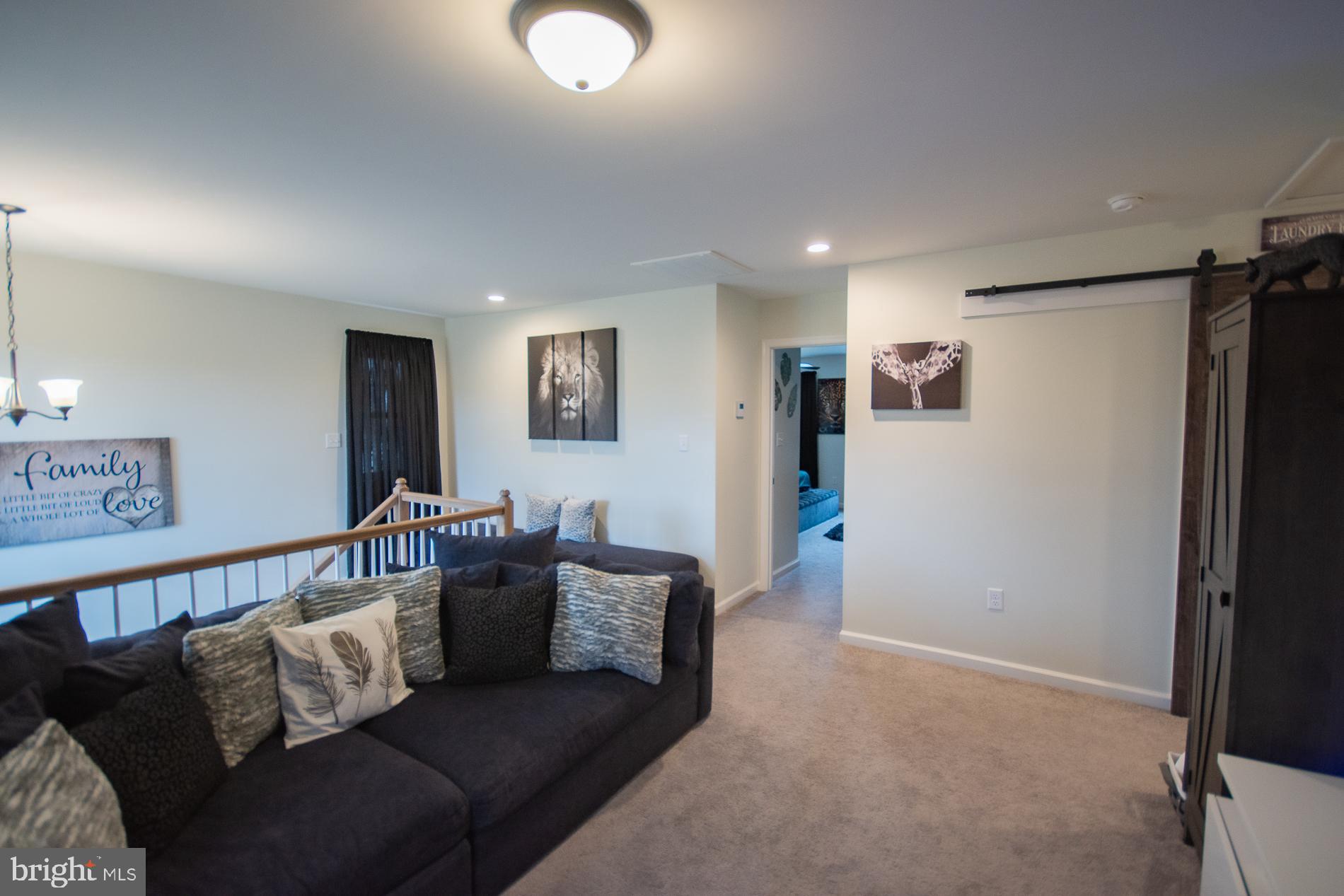 90 Larimar Lane Inwood, WV 25428 - Photo 27 of 66 a living room with furniture and a refrigerator
