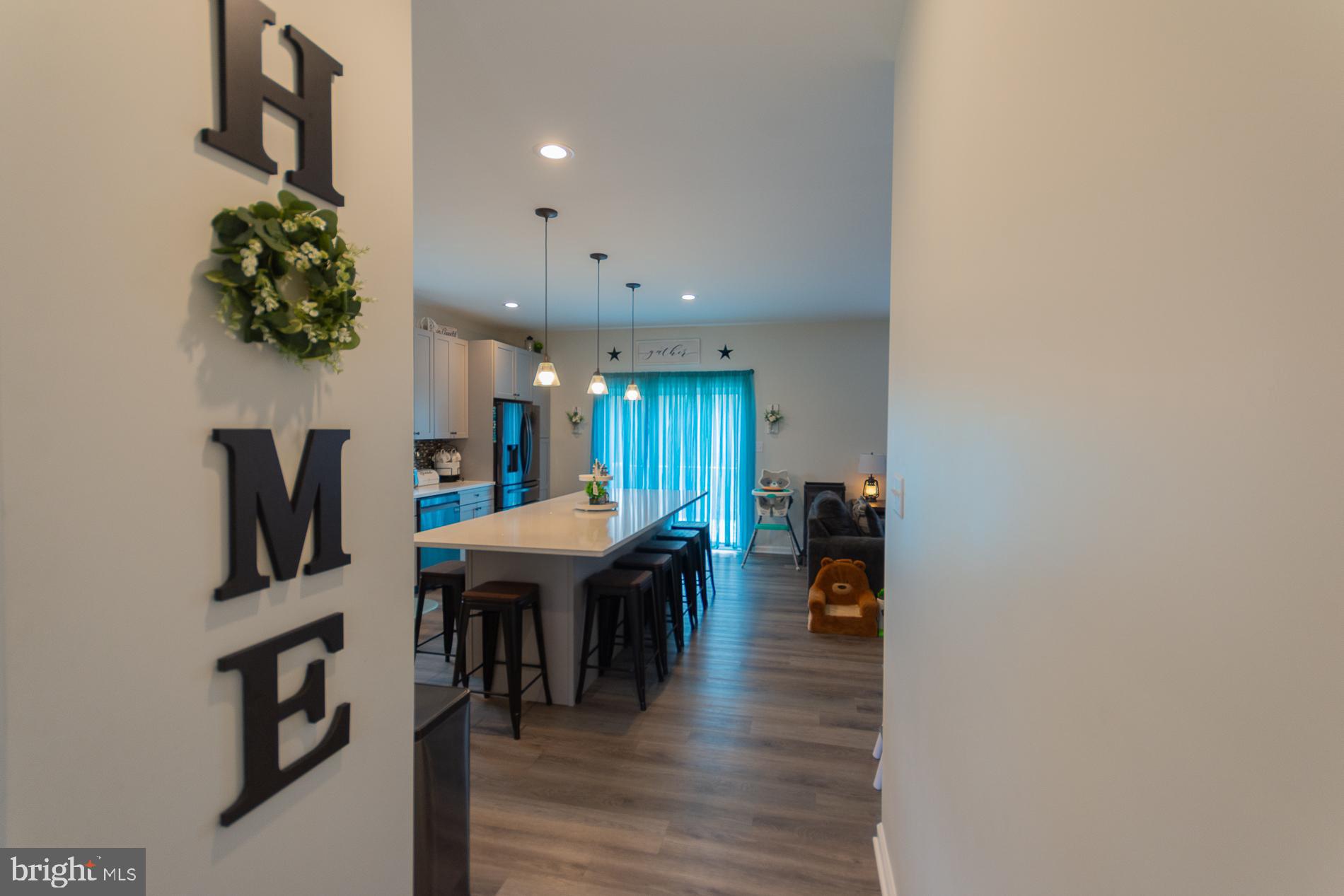 90 Larimar Lane Inwood, WV 25428 - Photo 3 of 66 a dining room with furniture and wooden floor