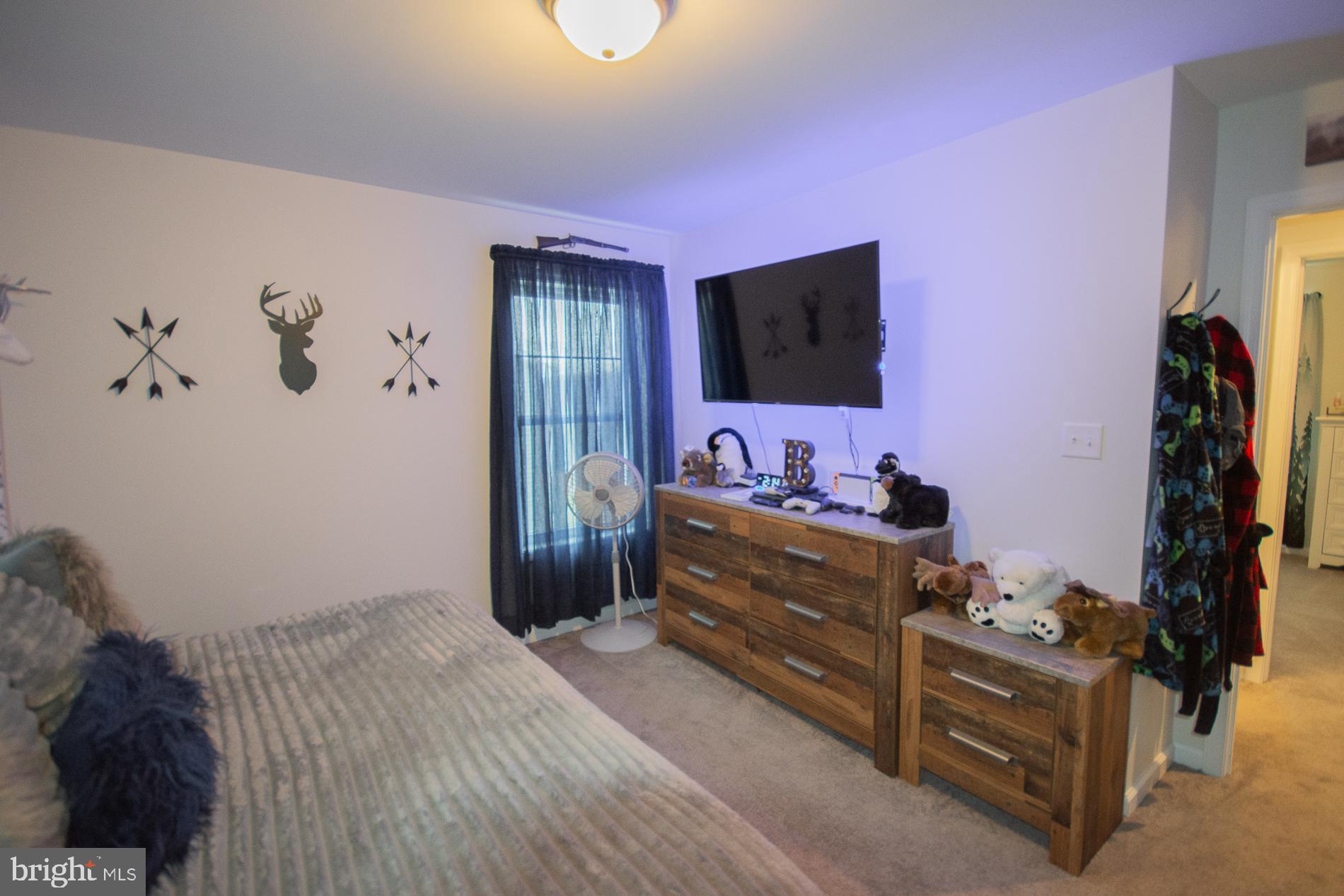 90 Larimar Lane Inwood, WV 25428 - Photo 31 of 66 a bed room with a bed and a flat screen tv