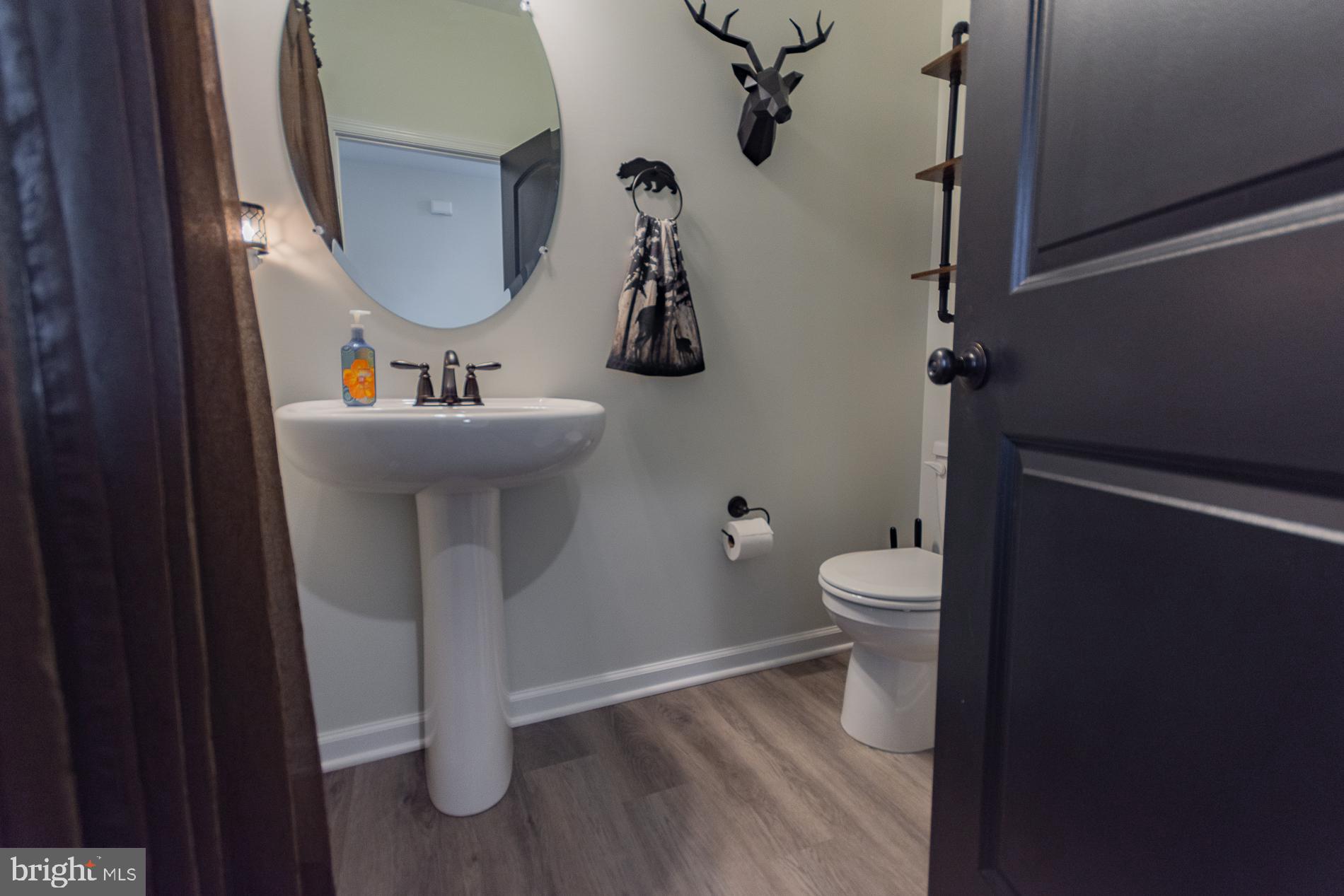 90 Larimar Lane Inwood, WV 25428 - Photo 4 of 66 a bathroom with a toilet sink and mirror