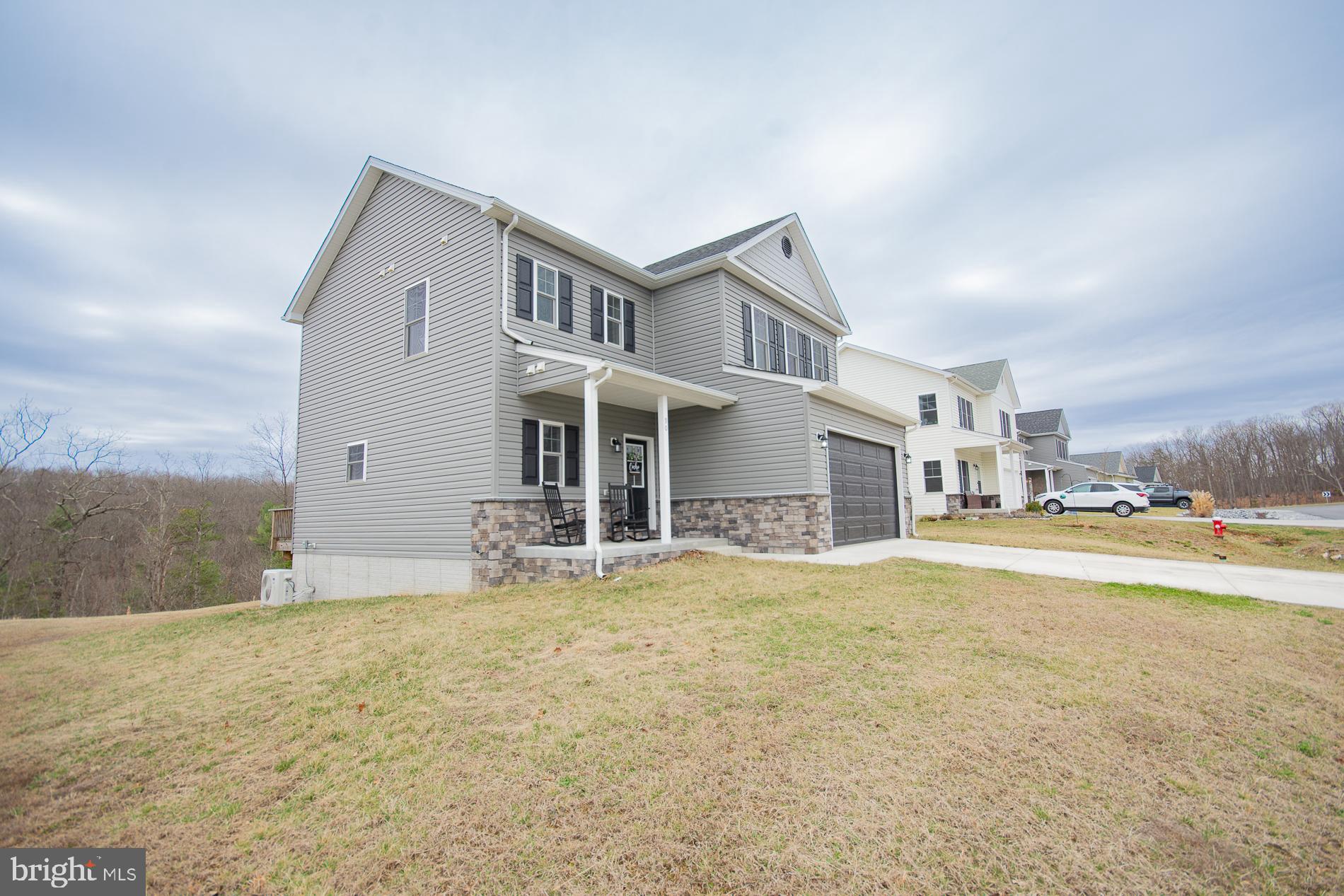 90 Larimar Lane Inwood, WV 25428 - Photo 49 of 66 a view of a house with a yard and sitting area