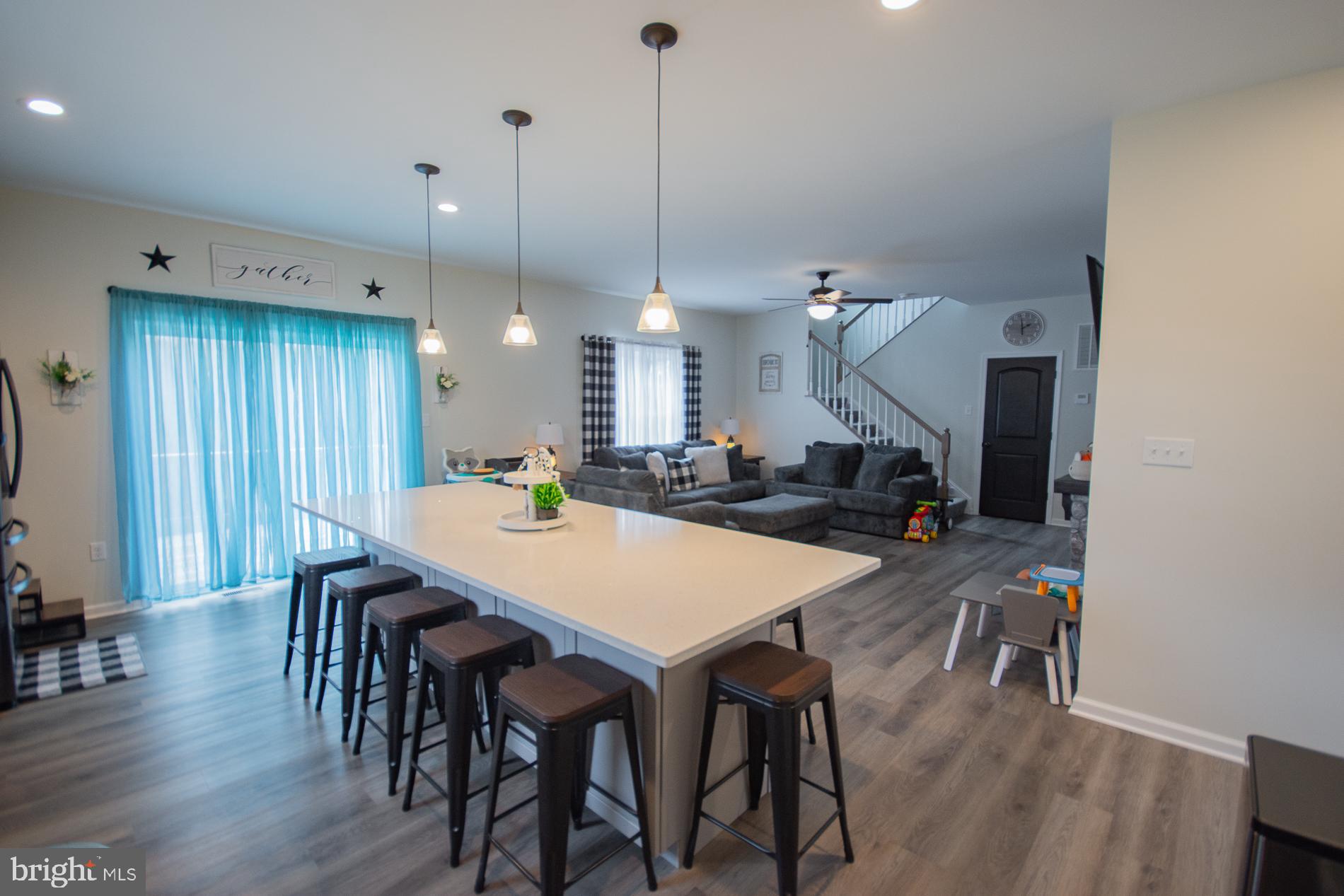 90 Larimar Lane Inwood, WV 25428 - Photo 6 of 66 a large kitchen with a table and chairs