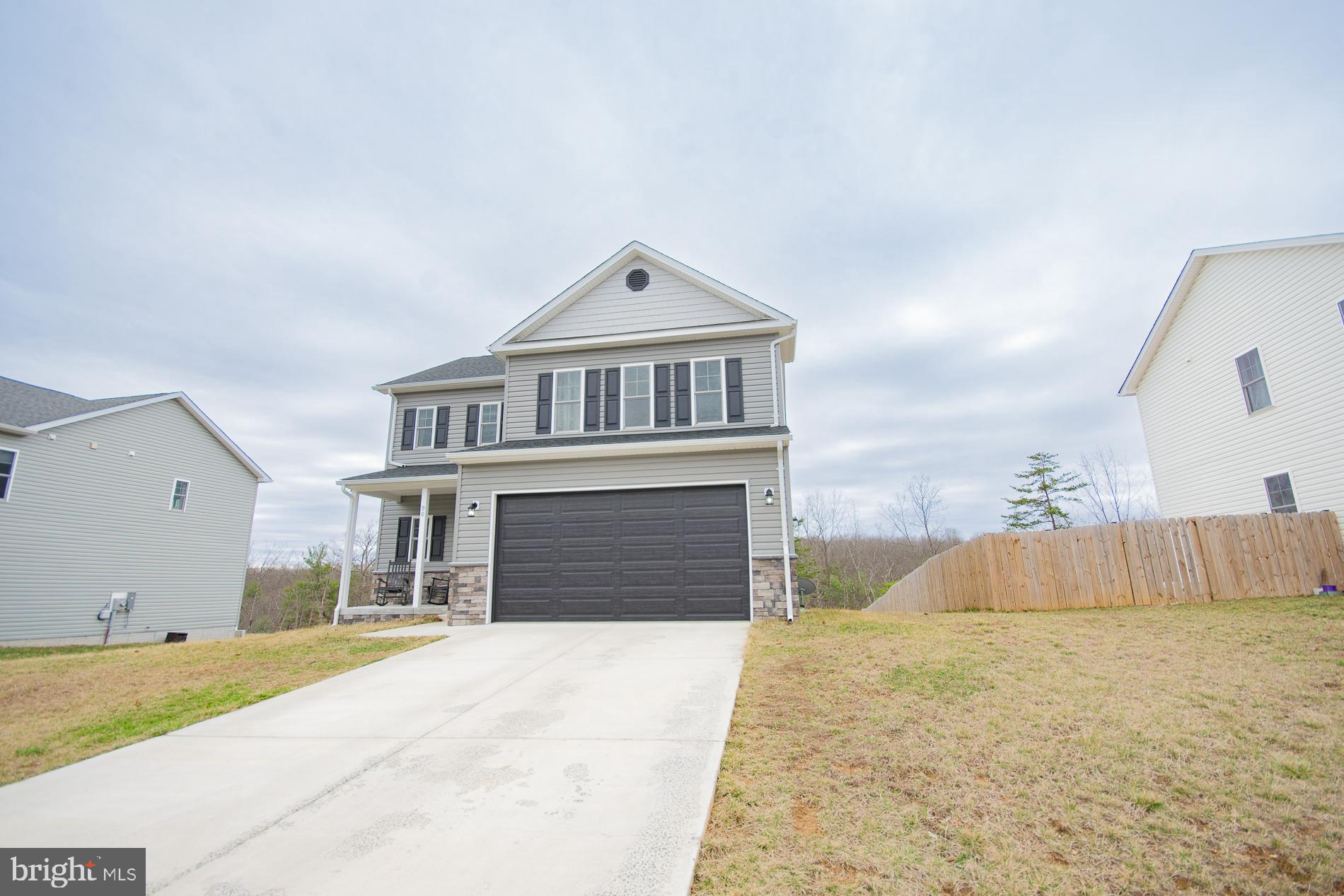 90 Larimar Lane Inwood, WV 25428 - Photo 63 of 66 a front view of a house with a garage