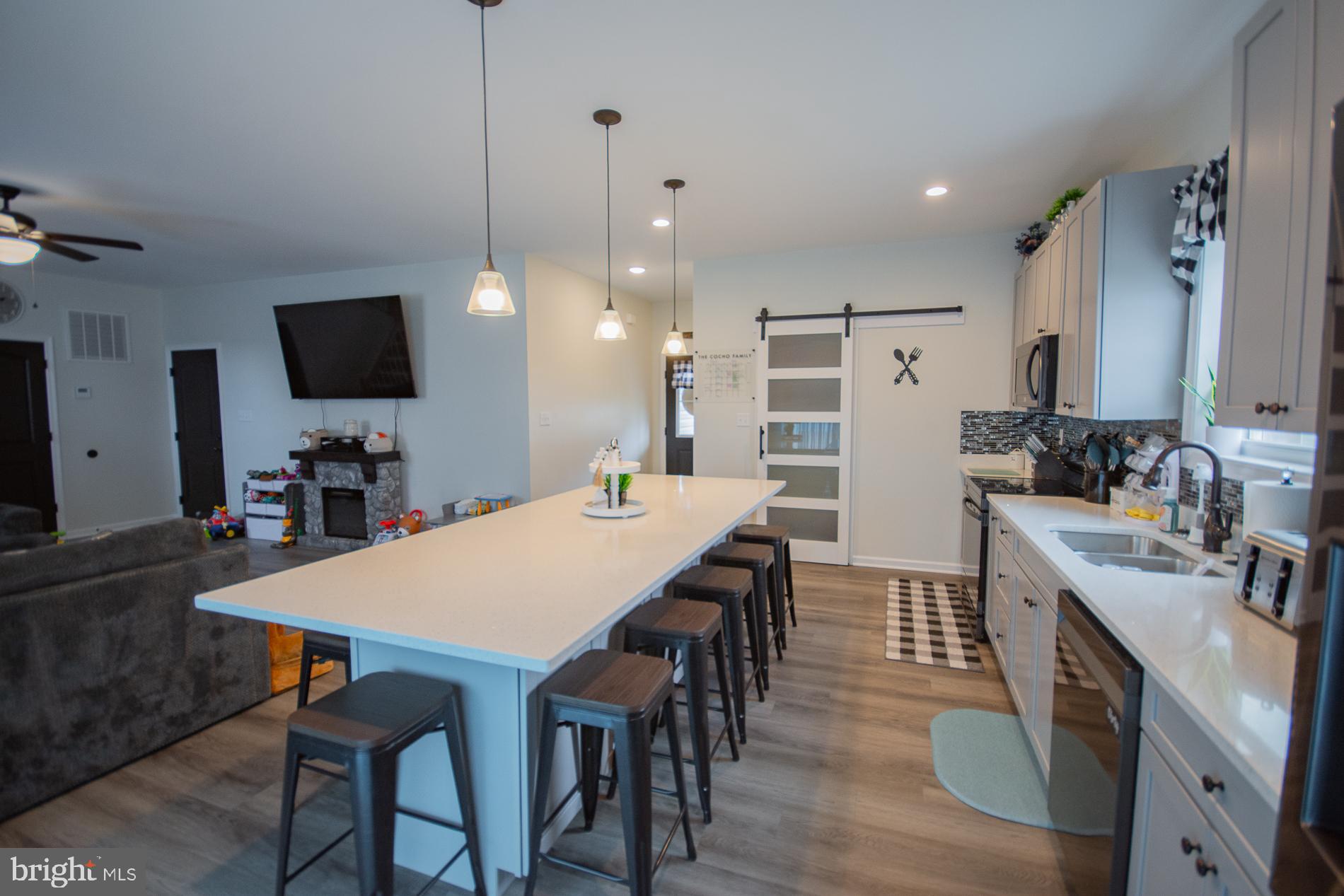 90 Larimar Lane Inwood, WV 25428 - Photo 8 of 66 a large kitchen with a table and chairs