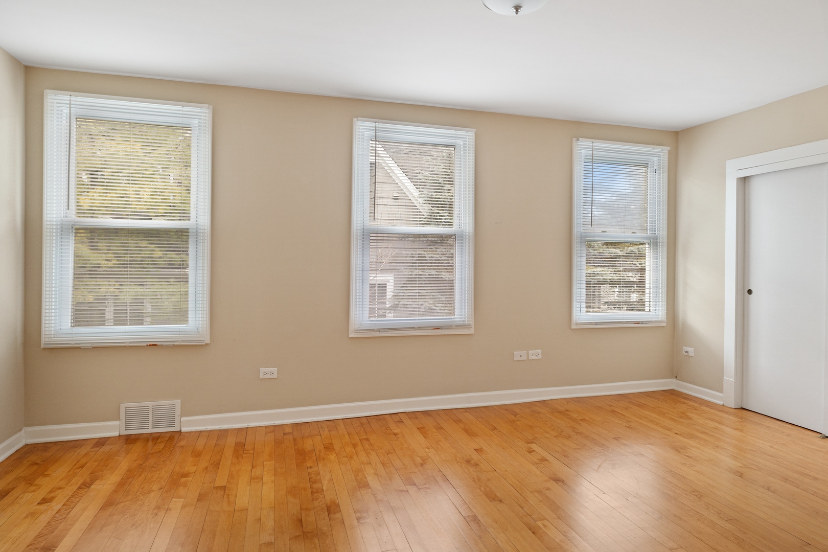 879 Willow Road Winnetka, IL 60093 - Photo 15 of 29 a view of an empty room with wooden floor and a window