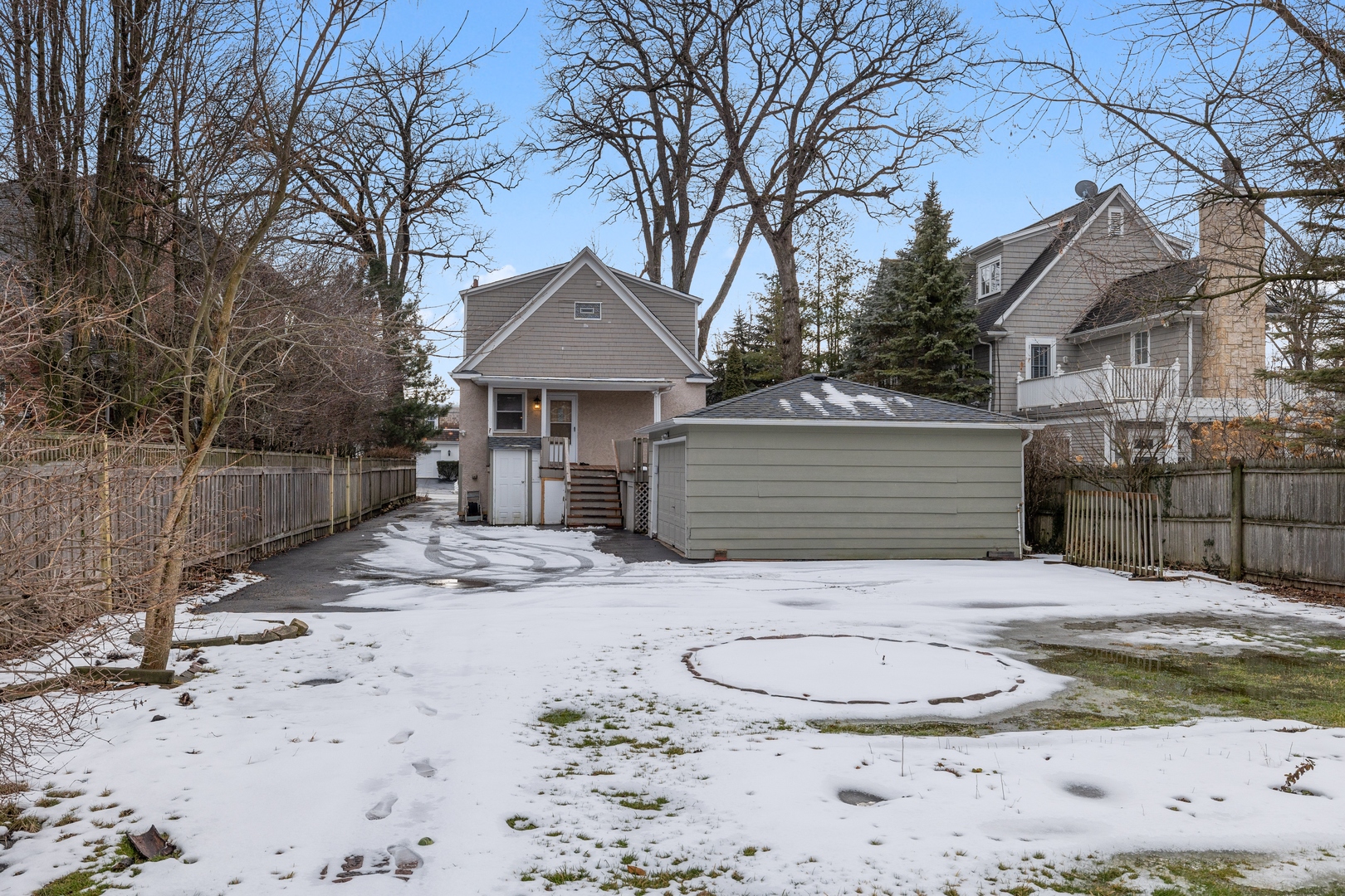 879 Willow Road Winnetka, IL 60093 - Photo 21 of 29 a view of a house with a yard covered in snow