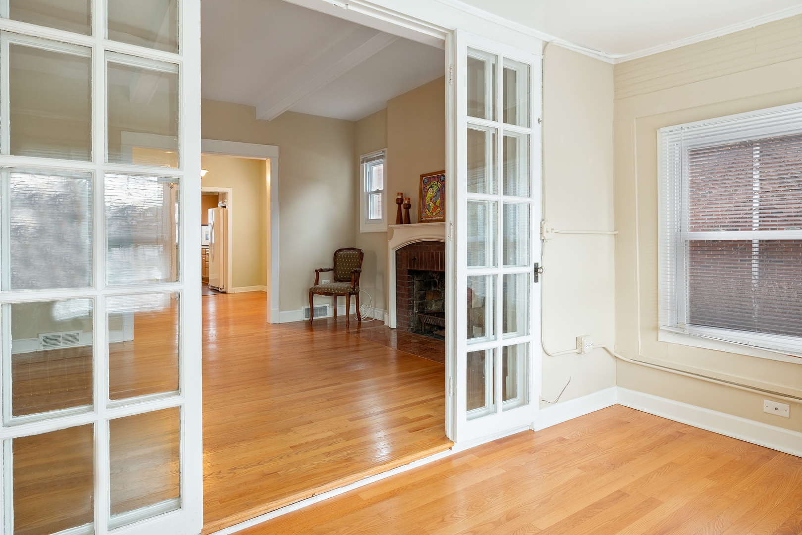 879 Willow Road Winnetka, IL 60093 - Photo 7 of 29 a view of a livingroom with wooden floor and a window