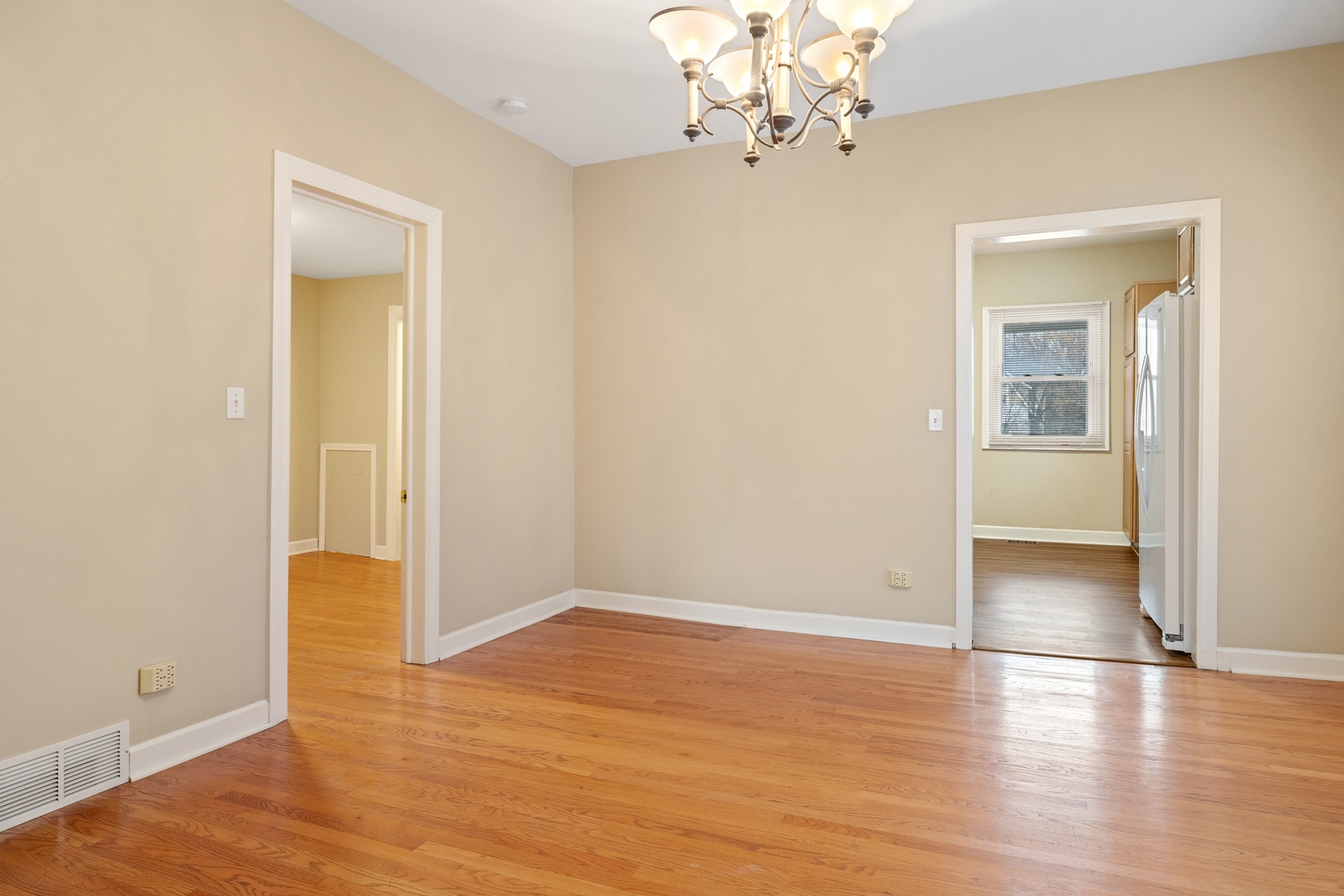 879 Willow Road Winnetka, IL 60093 - Photo 8 of 29 wooden floor in an empty room with a window