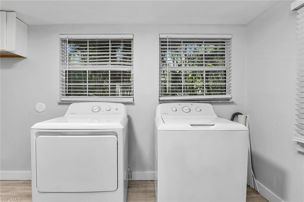 2780 Weeks Avenue Naples, FL 34112 - Photo 14 of 34 a utility room with dryer and washer
