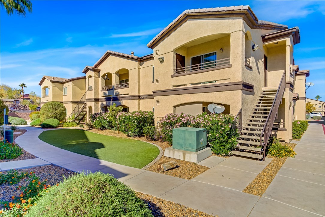 View of property featuring stairway